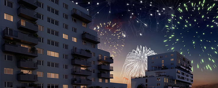 Feuerwerk über einer Mischek Wohnanlage mit freifinanzierten Eigentumswohnungen